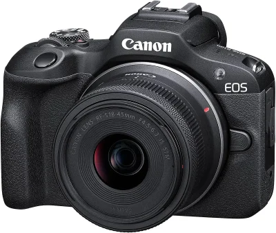 Fotocamera mirrorless Canon EOS R100 con obiettivo